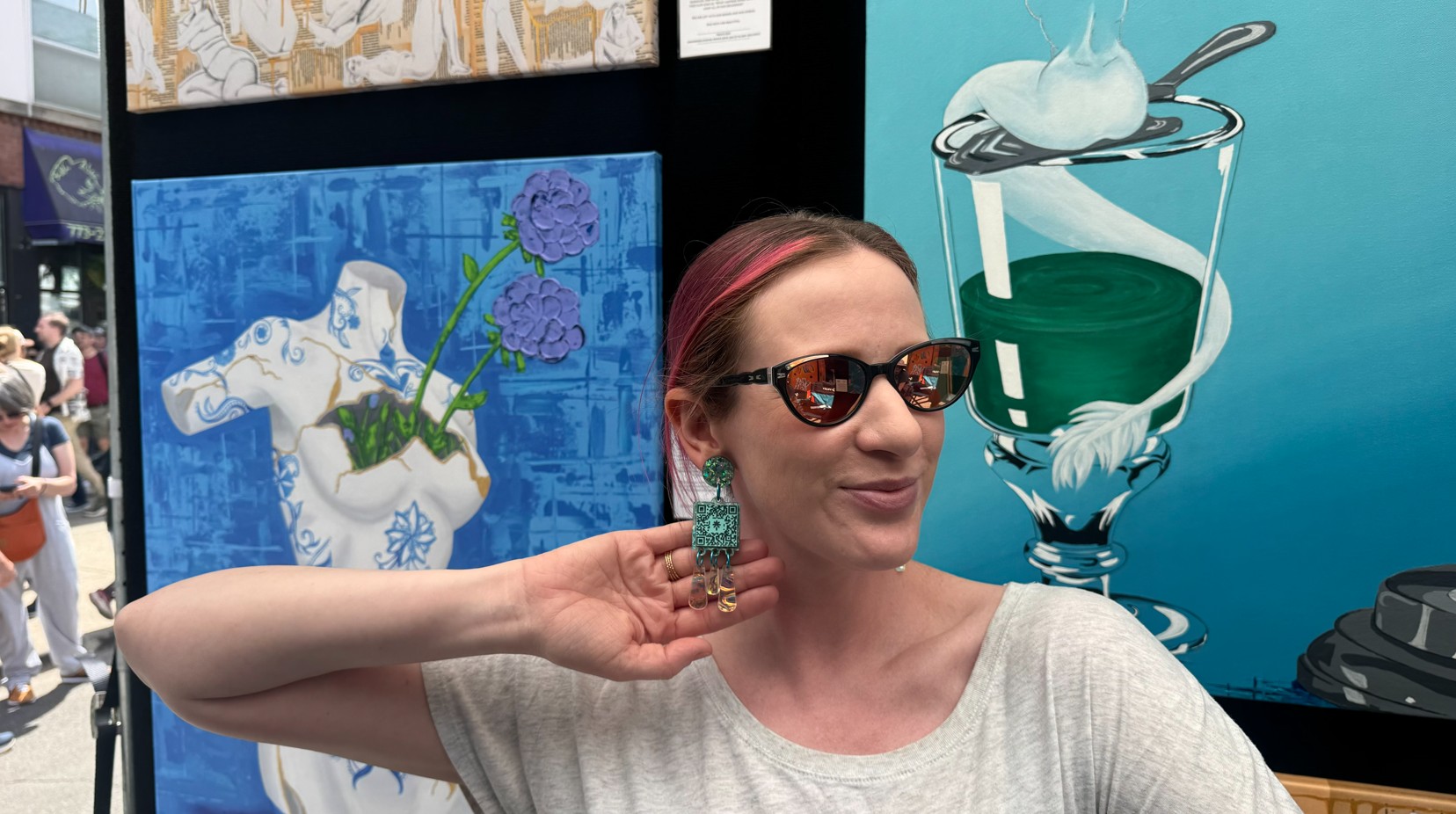 Emma Lyons showing off her earrings